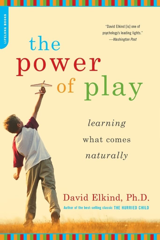 Book cover of The Power of Play: Learning What Comes Naturally by David Elkind, Ph.D. The design features a young boy holding up a toy airplane in a field, with colorful text on a cream background.