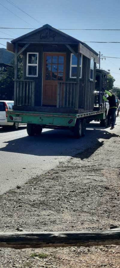 Small wooden playhouse from Wellspring Children’s Center being transported on a trailer as part of the school’s move from Los Osos to Templeton.